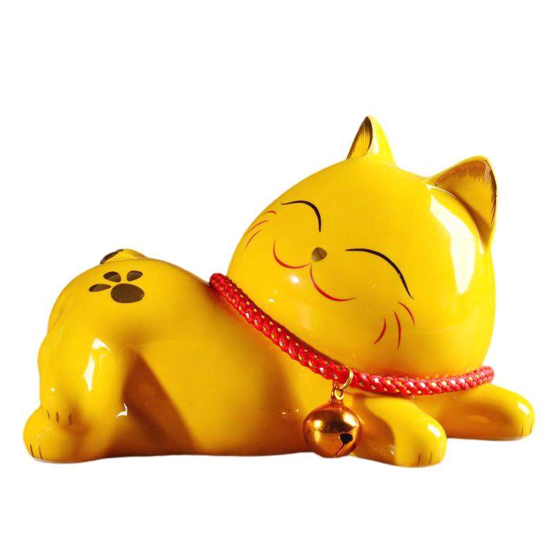 置物 寝そべる招き猫風 肉球模様 鈴付き首輪 ニッコリ笑顔 陶器製 (黄)